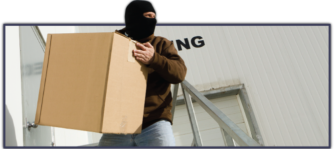 hooded figure stealing box from loading dock