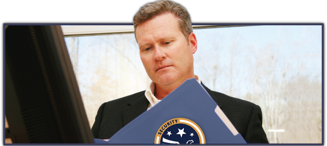 man reviewing information in folder